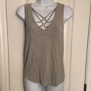 Tank top with cut out in front. Knot tie in the back. Size a. Great condition